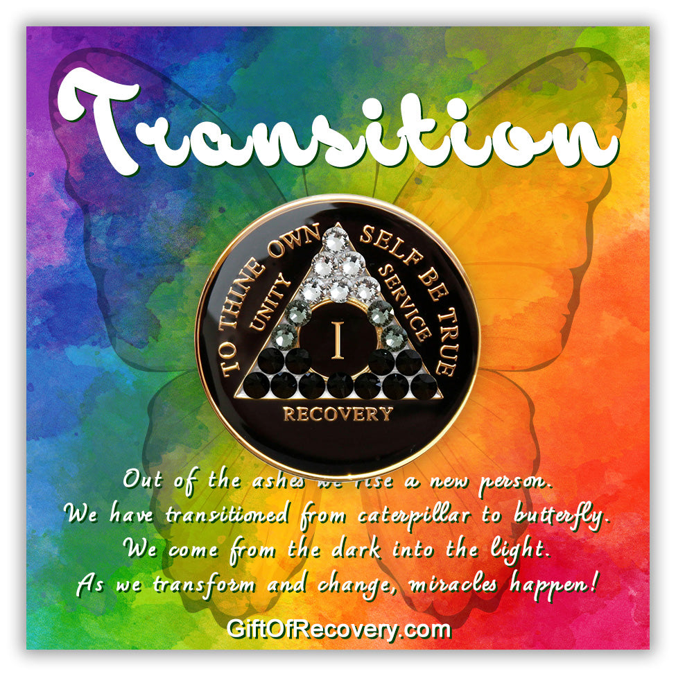 1 year AA recovery medallion black onyx with 21 genuine crystals ranging from clear to grey, to black, representing the transformation of the recovery journey, the AA moto along with unity, service, recovery, roman numeral, and the outer rim of medallion are embossed with 14k gold plated brass. The AA medallion is set on a bold colored 3x3 tie-dye card and has a silhouette of a butterfly in the background, the word transition and the small paragraph outlining the change of recovery, are in white lettering.