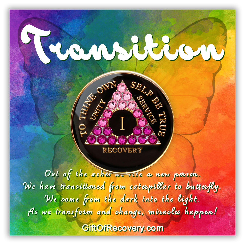 1 year black onyx AA medallion with 21 pink genuine crystals in the shape of the triangle representing transformation journey of recovery, the moto of AA is displayed on the front and embossed with 14k gold-plated brass, the recovery medallion is sealed in resin to last and is scratch proof, the medallion is featured on a 3x3 bold colored tie-dye card with a butterfly silhouette and a paragraph outlining a transitional view regarding recovery.