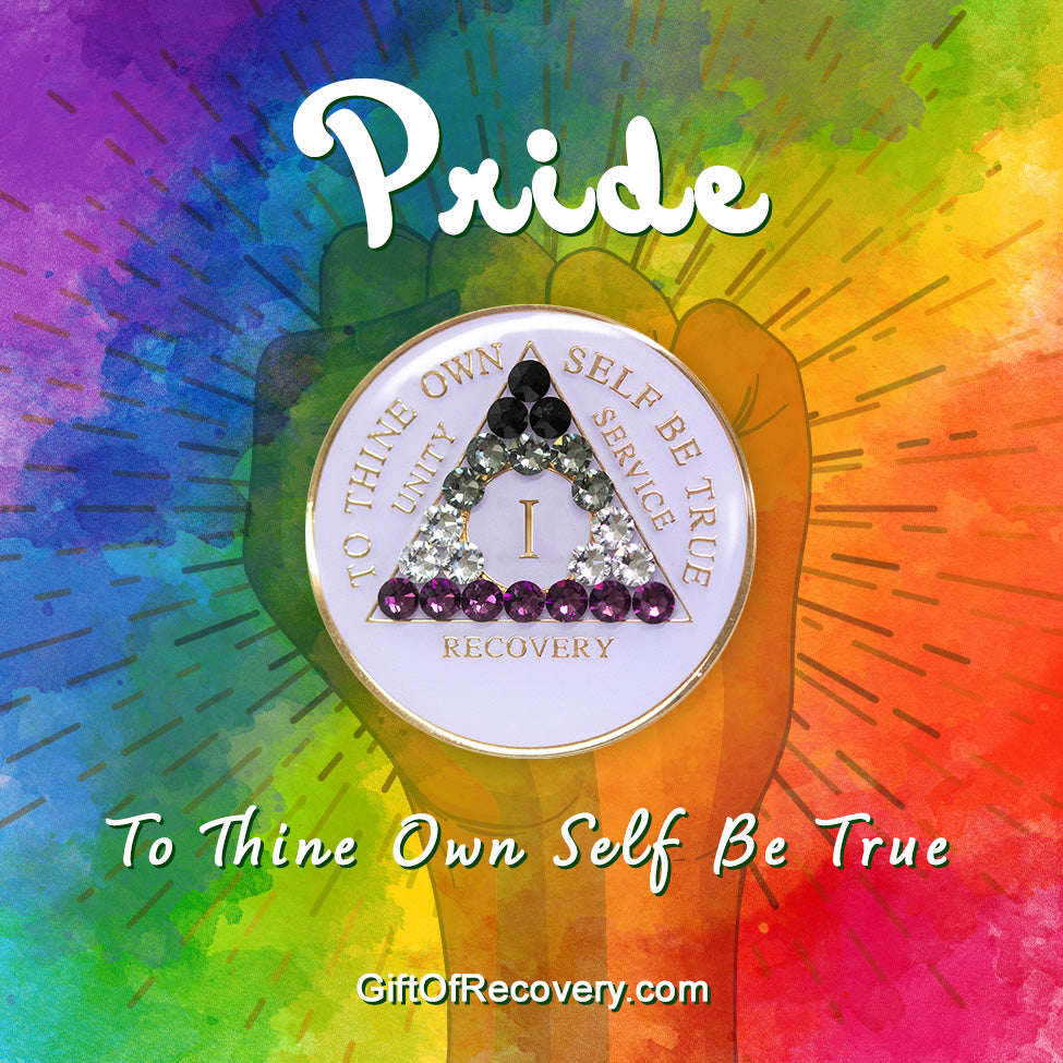 1 year AA medallion pearl white with 21 genuine crystals that make up the Asexual flag to represent recovery and pride, sobriety is a safe space, the AA slogan and three legacies are embossed with 14k gold-plated brass, sealed with resin for a glossy finish, pictured on a 3x3 tie-dye card with a silhouette of a fist and the words pride and to thine own self be true in the color white.