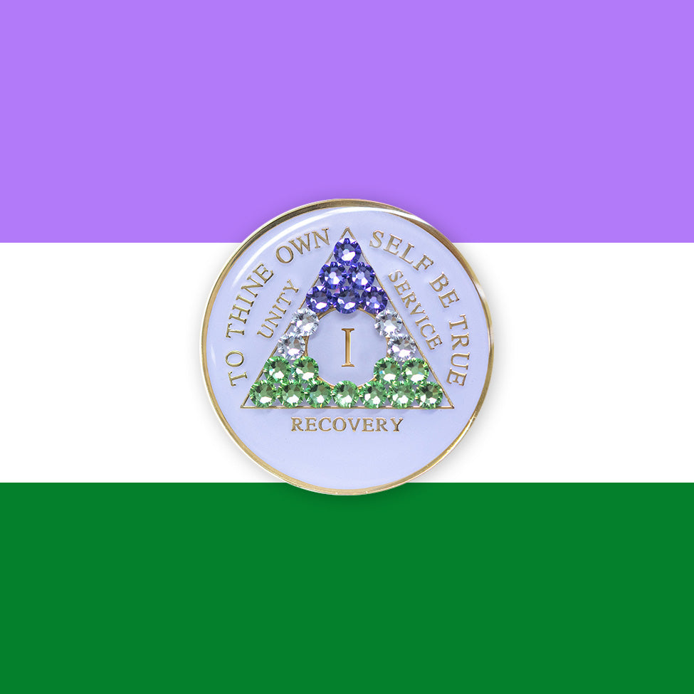 1 year AA medallion pearl white with 21 genuine crystals that form the triangle and are in the color of the Genderqueer flag, to represent pride and sobriety, the AA slogan and three legacies are embossed with 14k gold-plated brass and sealed with resin for a glossy finish that will last and is scratch proof, pictured on an image of the Genderqueer flag colors.
