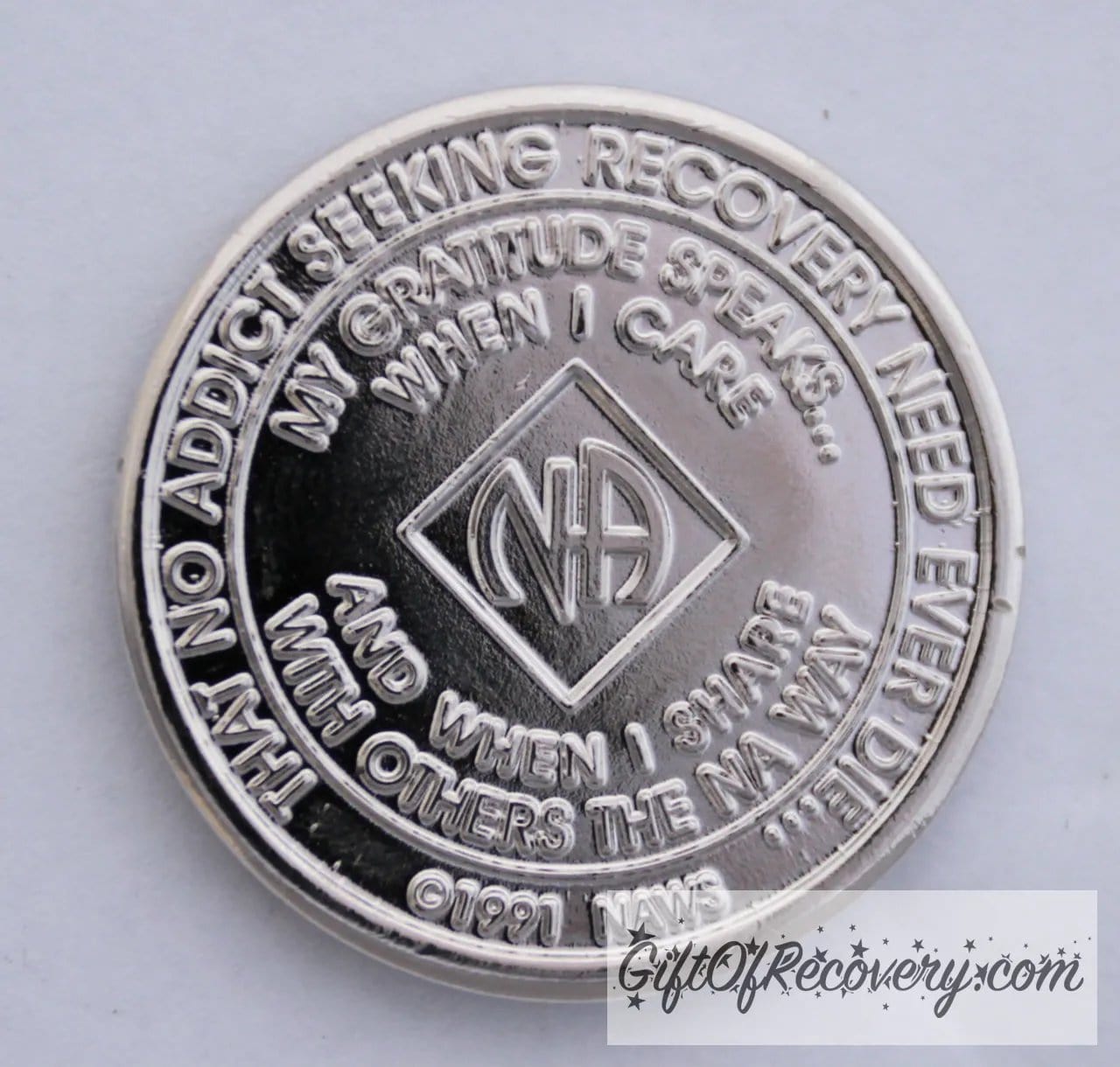Back of NA nickel plated crystalized diamond medallion has the NAWS official slogans and motto.