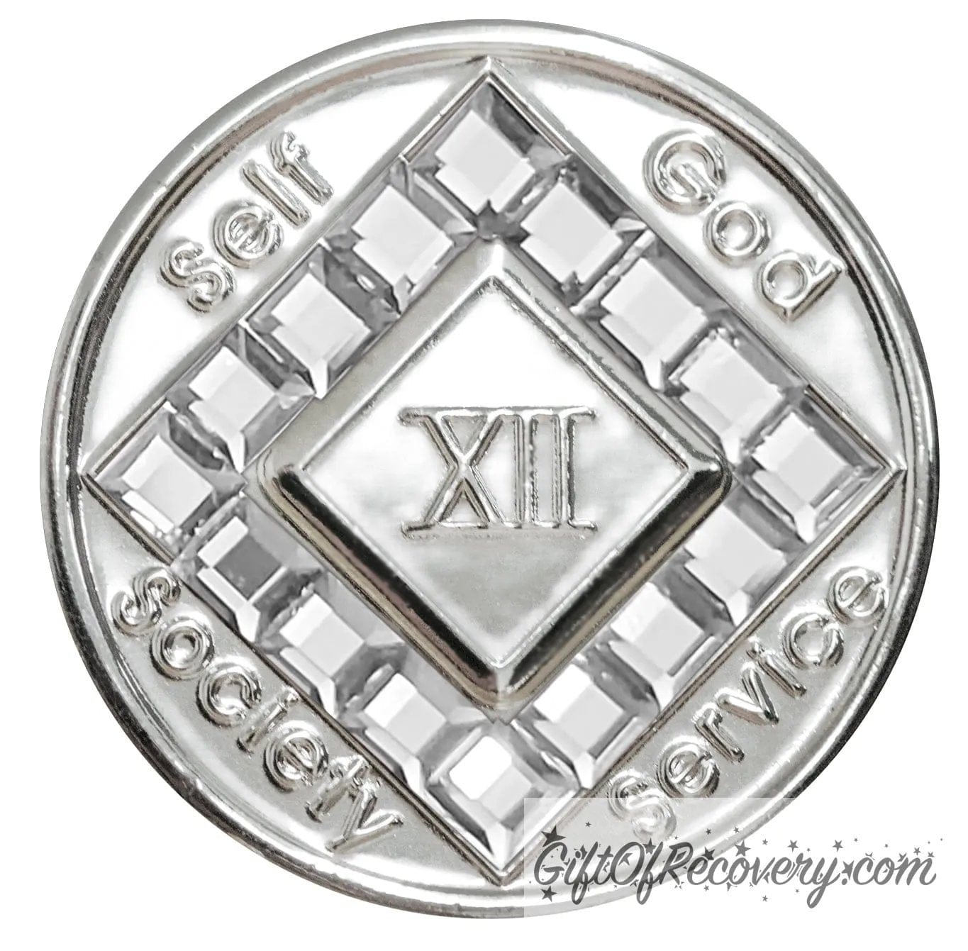 12 year nickel plated NA medallion with self, God, Society, and Service around the outer rim of the diamond, 16 square diamond CZ genuine crystals that form the diamond around the roman numeral.
