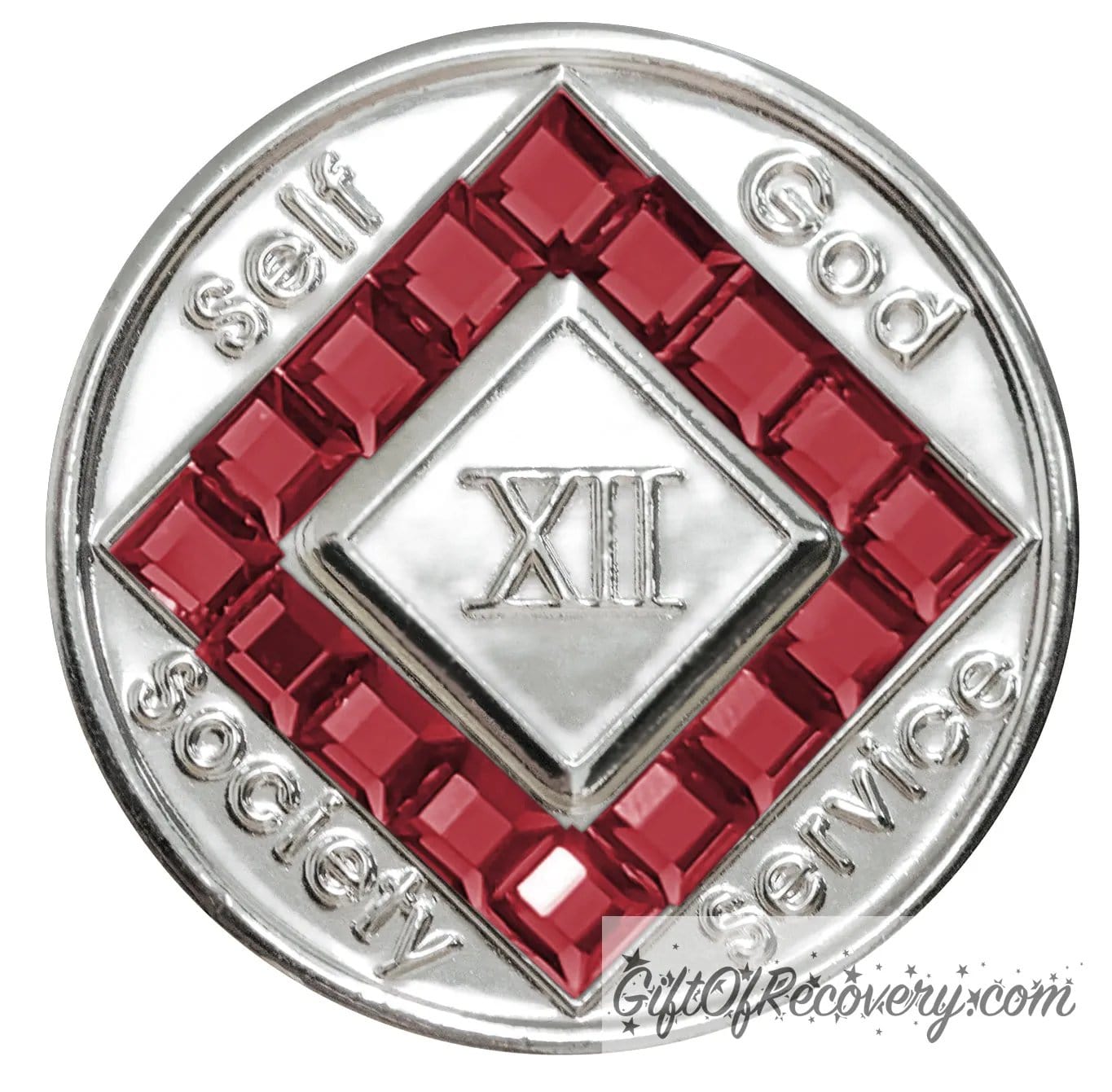 12 year nickel plated NA medallion with self, God, Society, and Service around the outer rim of the diamond, 16 square Scarlet red CZ genuine crystals that form the diamond around the roman numeral.