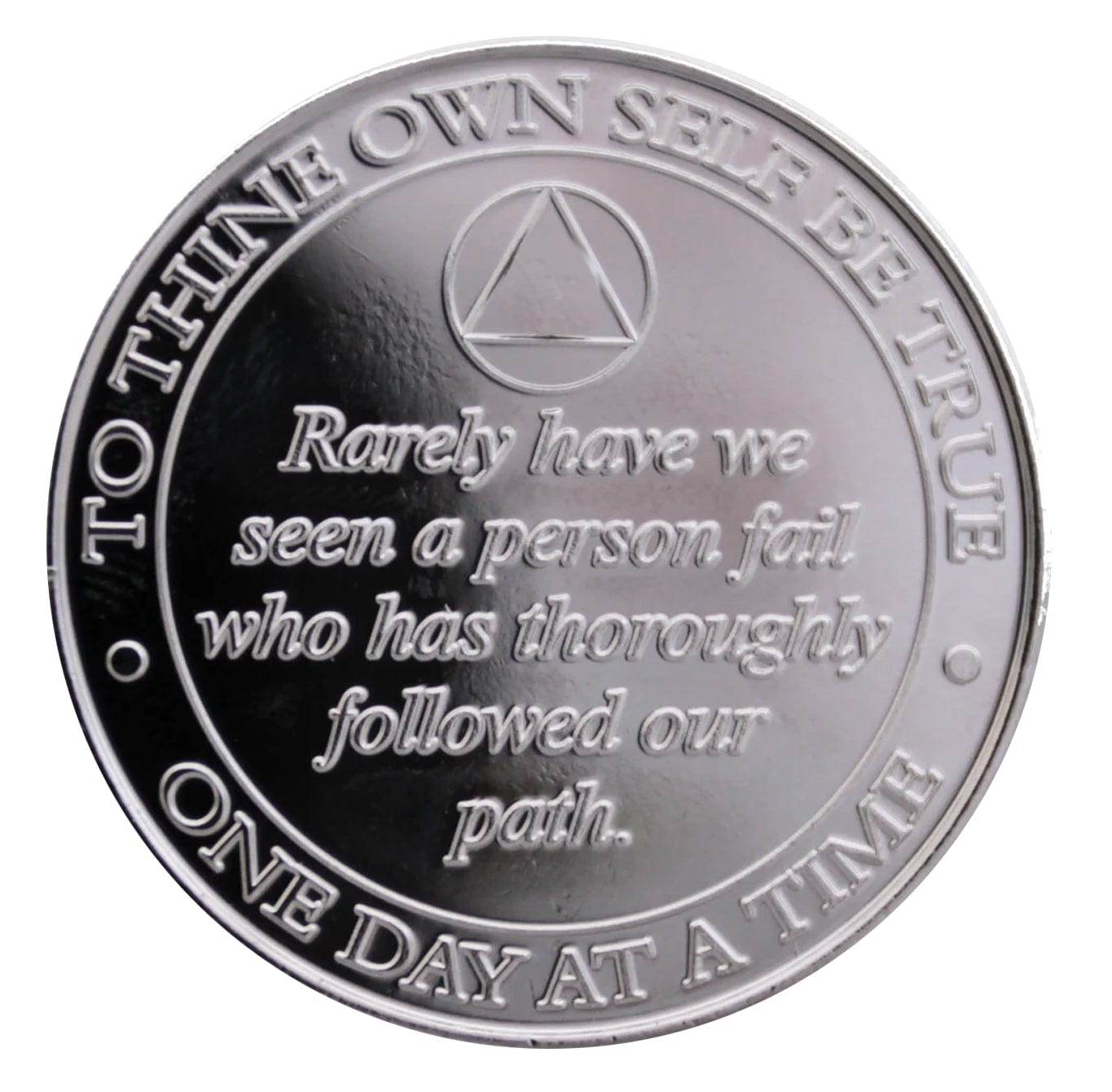 Back of 1 year nickel plated Bill & Bob aa recovery medallion, with rarely have we seen a person fail, and circle triangle at the top.