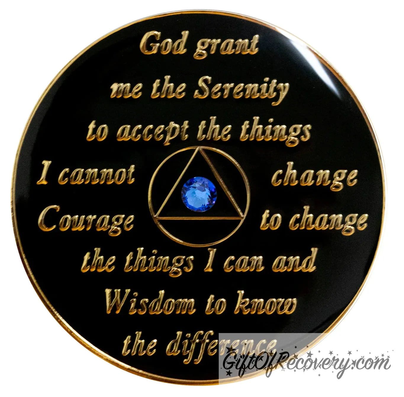 Back of transition AA recovery medallion is black onyx and has the serenity prayer, outer rim, and the circle triangle in the center 14k gold-plated brass, the circle and triangle are black with one single blue genuine crystal in the center of the triangle, the recovery medallion is sealed with resin for a shiny finish.