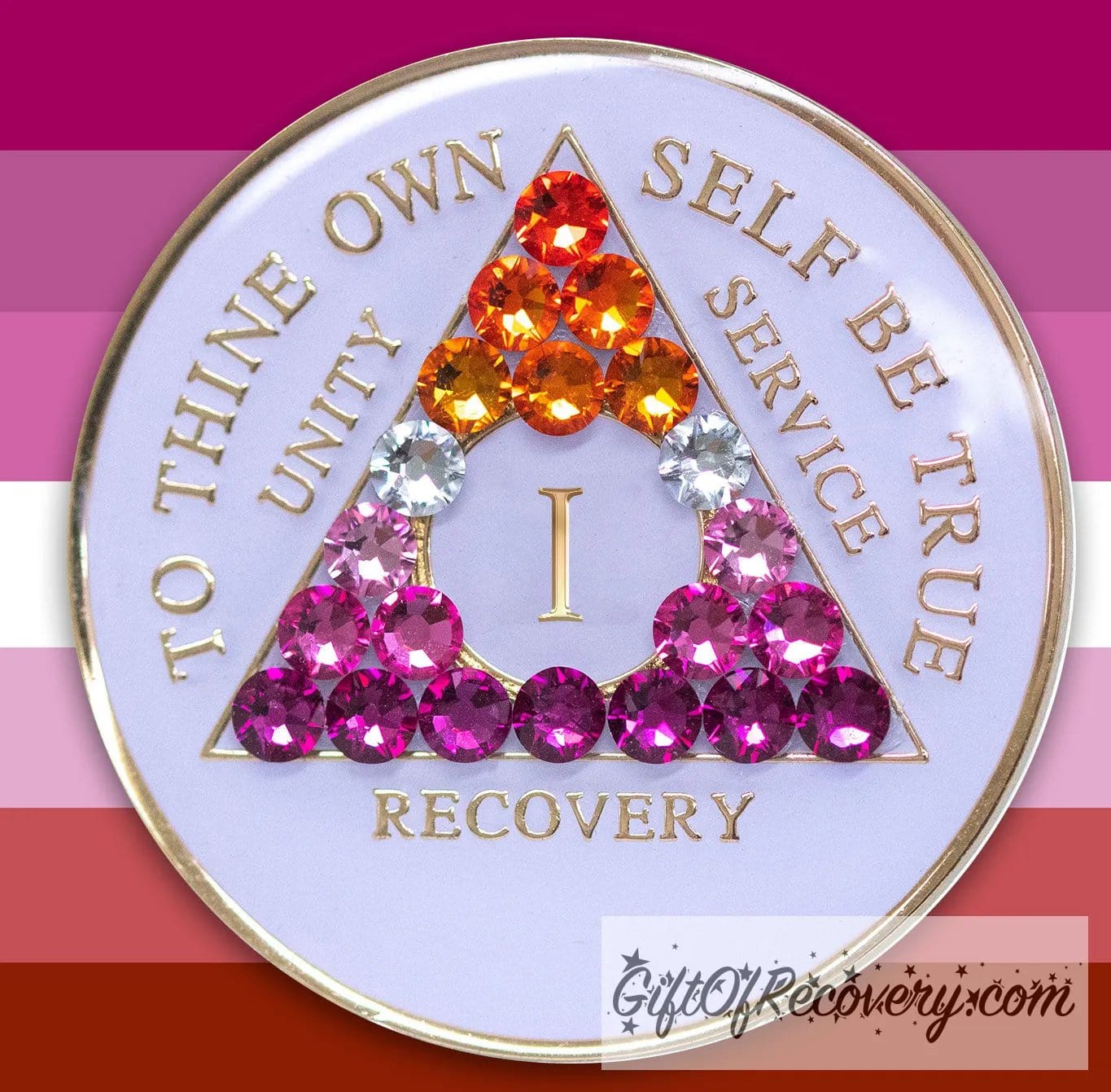 1 year AA medallion pearl white with 21 genuine crystals that form the triangle and are in the color of the Lesbian flag, colors are, to represent pride and sobriety, the AA slogan and three legacies are embossed with 14k gold-plated brass and sealed with resin for a glossy finish that will last and is scratch proof, pictured on an image of the Lesbian flag colors.