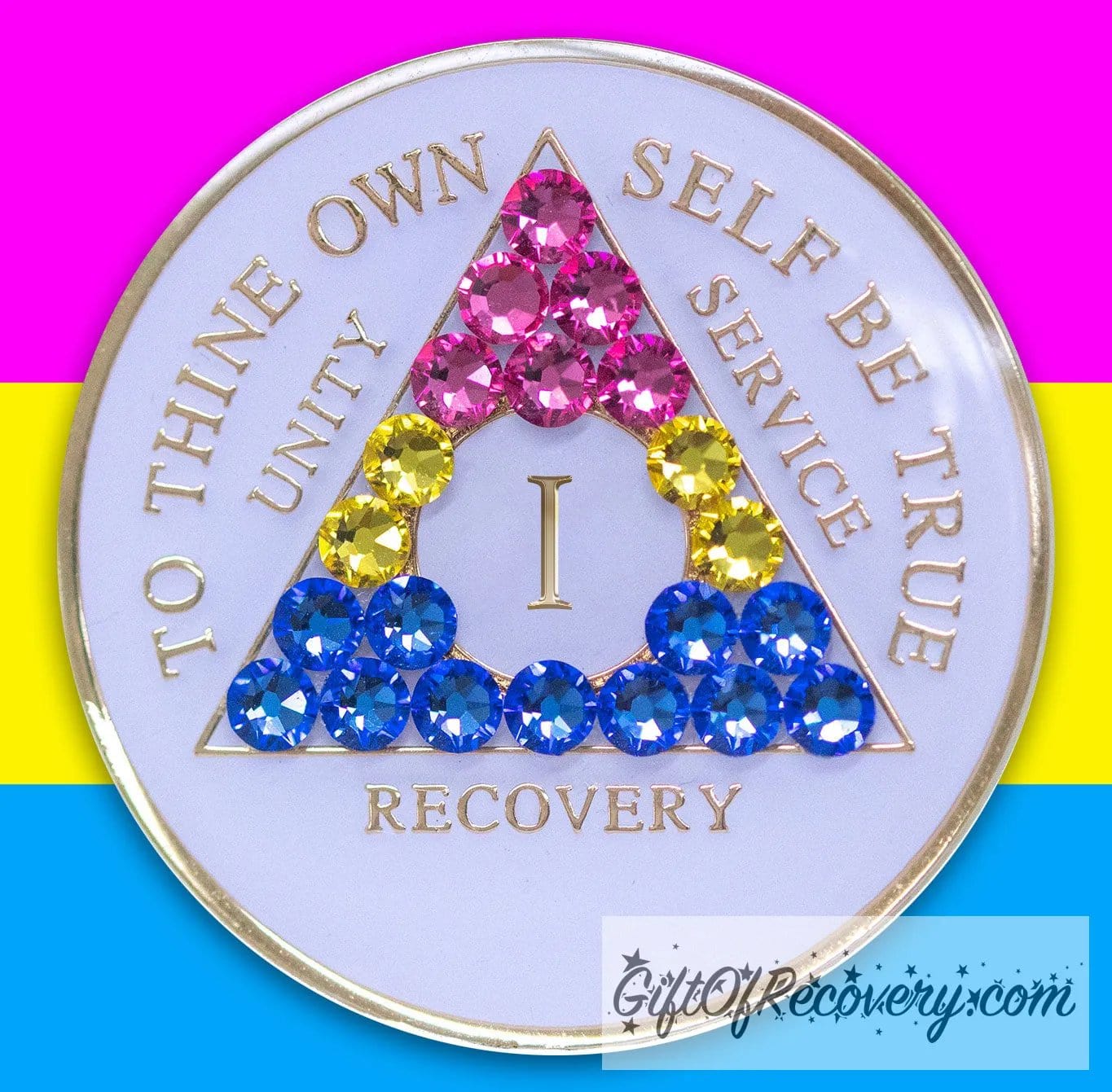 1 year AA medallion pearl white with 21 genuine crystals that form the triangle and are in the color of the Pansexual flag, to represent pride and sobriety, the AA slogan and three legacies are embossed with 14k gold-plated brass and sealed with resin for a glossy finish that will last and is scratch proof, pictured on an image of the Pansexual flag colors.