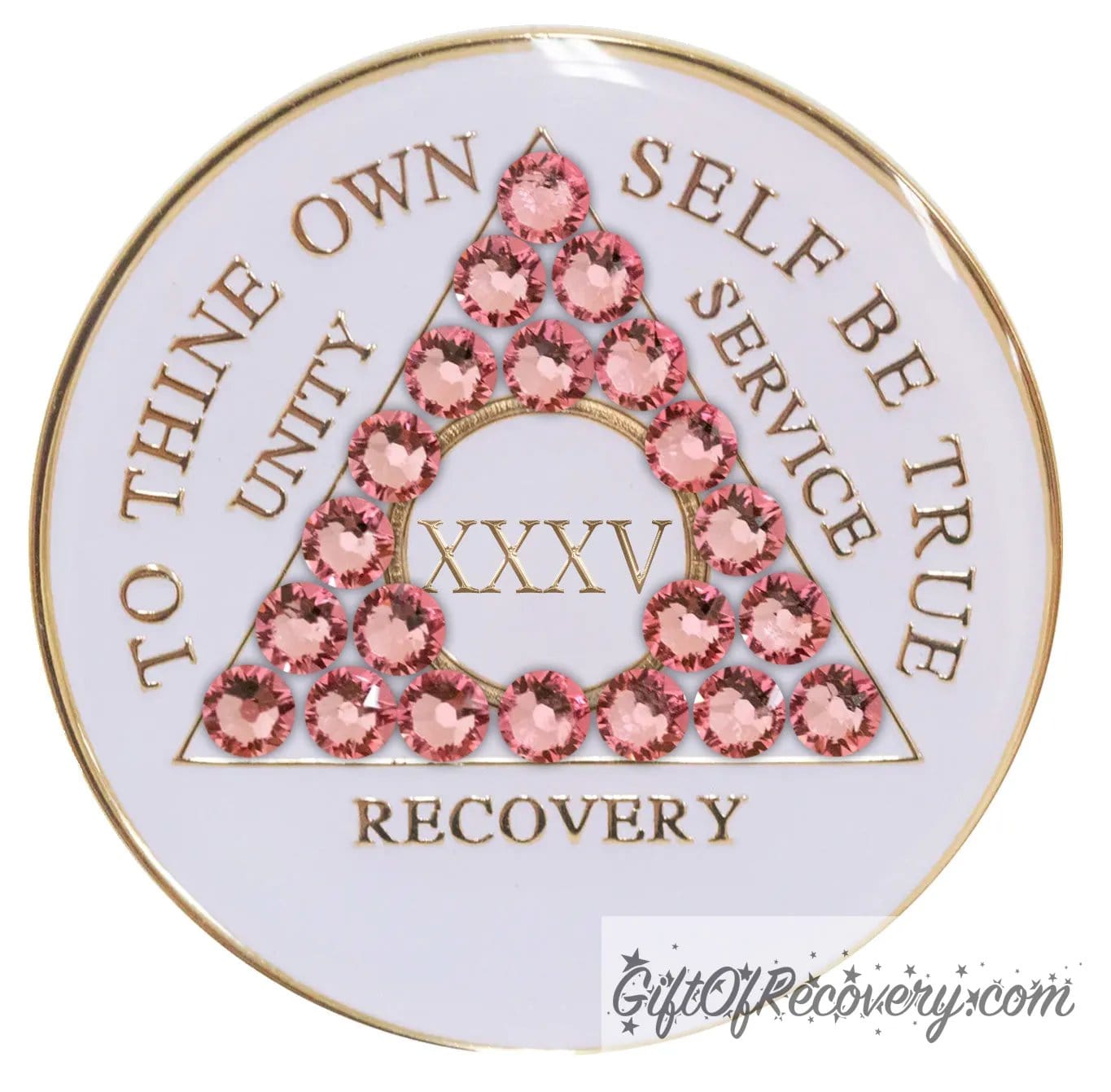 35 year pearl white AA medallion with Twenty-one genuine rose crystals in the shape of the triangle, unity, service, recovery, roman numeral, and to thine own self be true, embossed in 14k gold-plated brass and sealed with resin for a glossy finish that is scratch proof and will last.