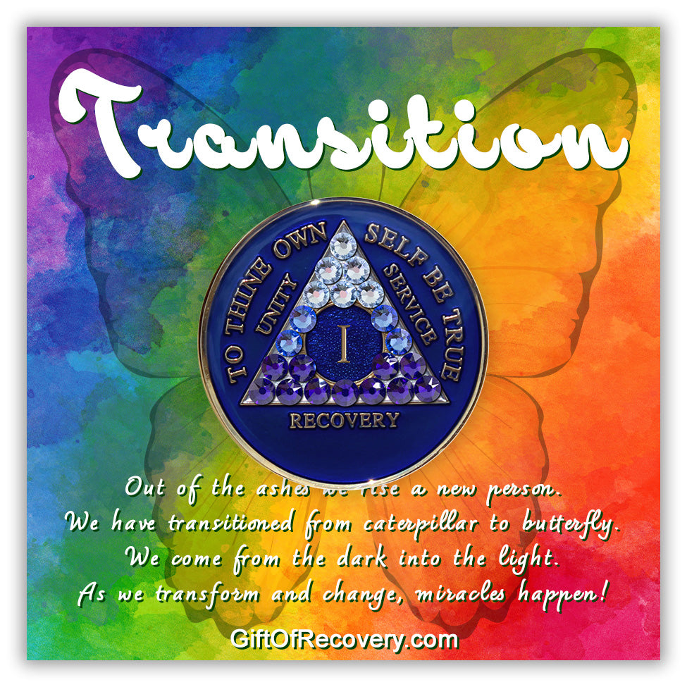 1 year Big Book Blue AA medallion with 21 genuine crystals forming the triangle, going from light to dark blue to represent transitions in your recovery journey, the center circle is blue sparkle, with the roman numeral, AA moto and rim in 14k gold plated brass and resin sealed for a glossy finish. The recovery medallion is set on a bold colored tie-dye 3x3 card with a silhouette of a butterfly and a paragraph about transformation.