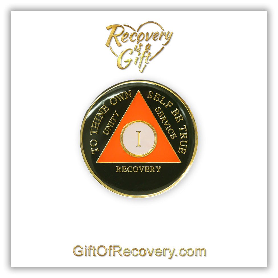 1 year AA medallion black Onyx, triangle is orange, triangle is pearl white, to thine own self be true, unity, service, recovery, and roman numeral are embossed with 14k gold-plated brass, the recovery medallion is sealed with resin for a glossy finish that will last and is scratch free, pictured on a white 3x3 card with recovery is a gift going through an open heart at the top and giftofrecovery.com on the bottom, both in the color gold.