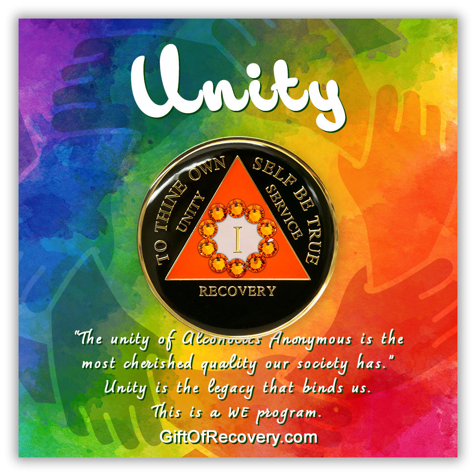 1 year Recovery Medallion black onyx and orange sunset triangle and 10 genuine orange crystals representing unity in AA, trim and wording on medallion is embossed 14k gold-plated brass and sealed with resin for a glossy finish, the AA medallion is featured on a 3x3 bold tie-dye card, with a silhouette of hands in a circle, a bold white AA circle triangle logo, and the word unity at the top and a paragraph on the bottom, emphasizing unity in the recovery journey.