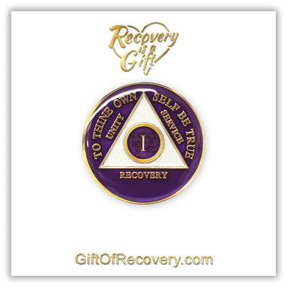 1 year AA medallion Amethyst purple, recovery is possible, triangle is pearl white, to thine own self be true, unity, service, recovery, and roman numeral are embossed with 14k gold-plated brass, the recovery medallion is sealed with resin for a glossy finish that will last and is scratch free, pictured on a white 3x3 card with recovery is a gift going through an open heart at the top and giftofrecovery.com on the bottom, both in the color gold.