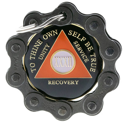 Black Bike Chain recovery medallion Holder with silver key ring, featured with black and orange AA recovery medallion.