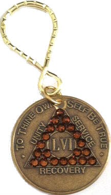 Bronze Key Tag pictured with a bronze AA 56 year medallion and 21 gold genuine crystals for the triangle.