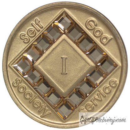 1 year bronze NA medallion with self, God, Society, and Service around the outer rim of the diamond, 16 diamond shaped CZ genuine Colorado Topaz crystals, that form the diamond around the roman numeral. 