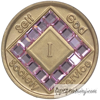 1 year bronze NA medallion with self, God, Society, and Service around the outer rim of the diamond, 16 diamond shaped CZ genuine light rose crystals, that form the diamond around the roman numeral. 