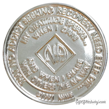 Back of NA nickel plated crystalized light rose medallion has the NAWS official slogans and motto. 