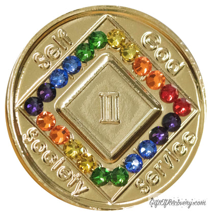 2 year gold plated NA medallion with self, God, Society, and Service around the outer rim of the diamond, 22 rainbow CZ genuine crystals, 2 of each color, that form the diamond around the roman numeral. 