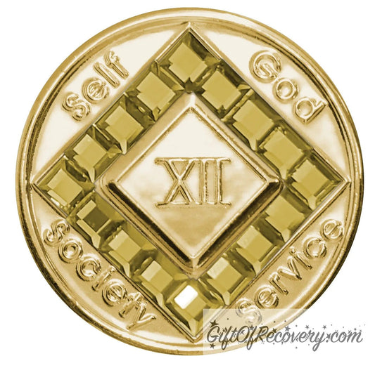 12 year gold plated NA medallion with self, God, Society, and Service around the outer rim of the diamond, 16 square gold CZ genuine crystals that form the diamond around the roman numeral. 