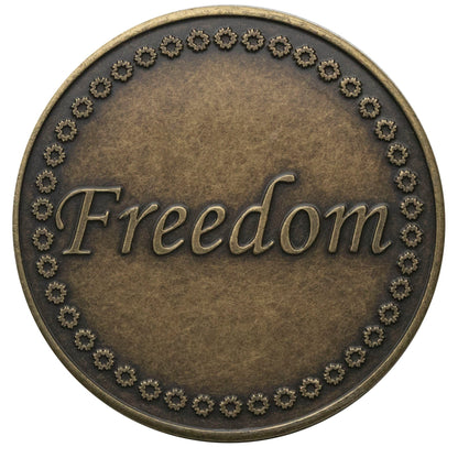 Freedom Recovery medallion in Bronze, with the word freedom in the center and a design going around the outer edge.