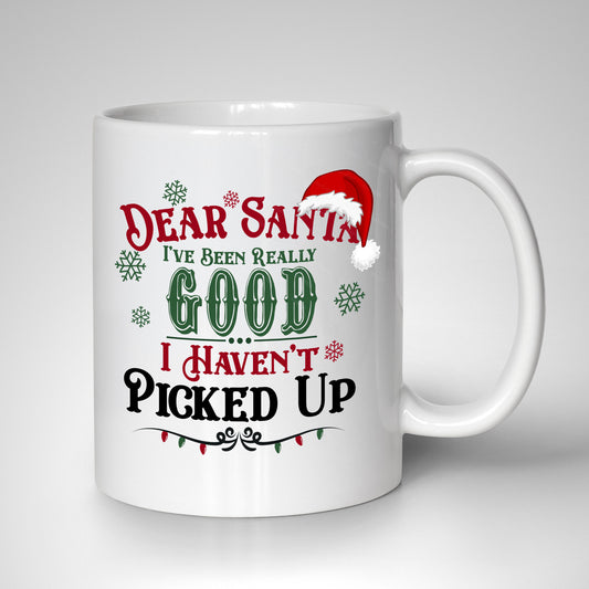 Celebrate sobriety this holiday season with the Dear Santa, I Have Been Very Good, I Haven't Picked Up 15oz Sober Christmas Mug. Festive lettering, a Santa hat, snowflakes, and red and green Christmas lights make it a perfect holiday gift.