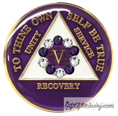 5 year AA medallion Purple Amethyst with 5 clear CZ genuine crystals and 5 purple in a circle around the roman numeral to represent the 10th step of the program, to thine own self be true and AA moto are embossed with 14k gold-plated brass, the triangle is pearl white and the recovery medallion is sealed with resin for a shiny finish that will last and is scratch proof.