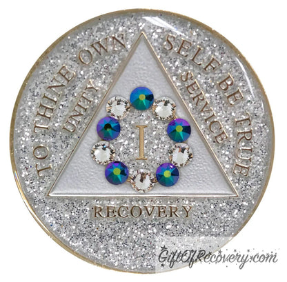 1 year silver glitter AA medallion, featuring 10 genuine crystals formed in a circle around the year, 5 clear and 5 scarabaeus-green, hand painted with unity, service, recovery, to thine own self be true, year, and outer edge embossed with 14k gold plated, sealed in high gloss resin for shine and durability.