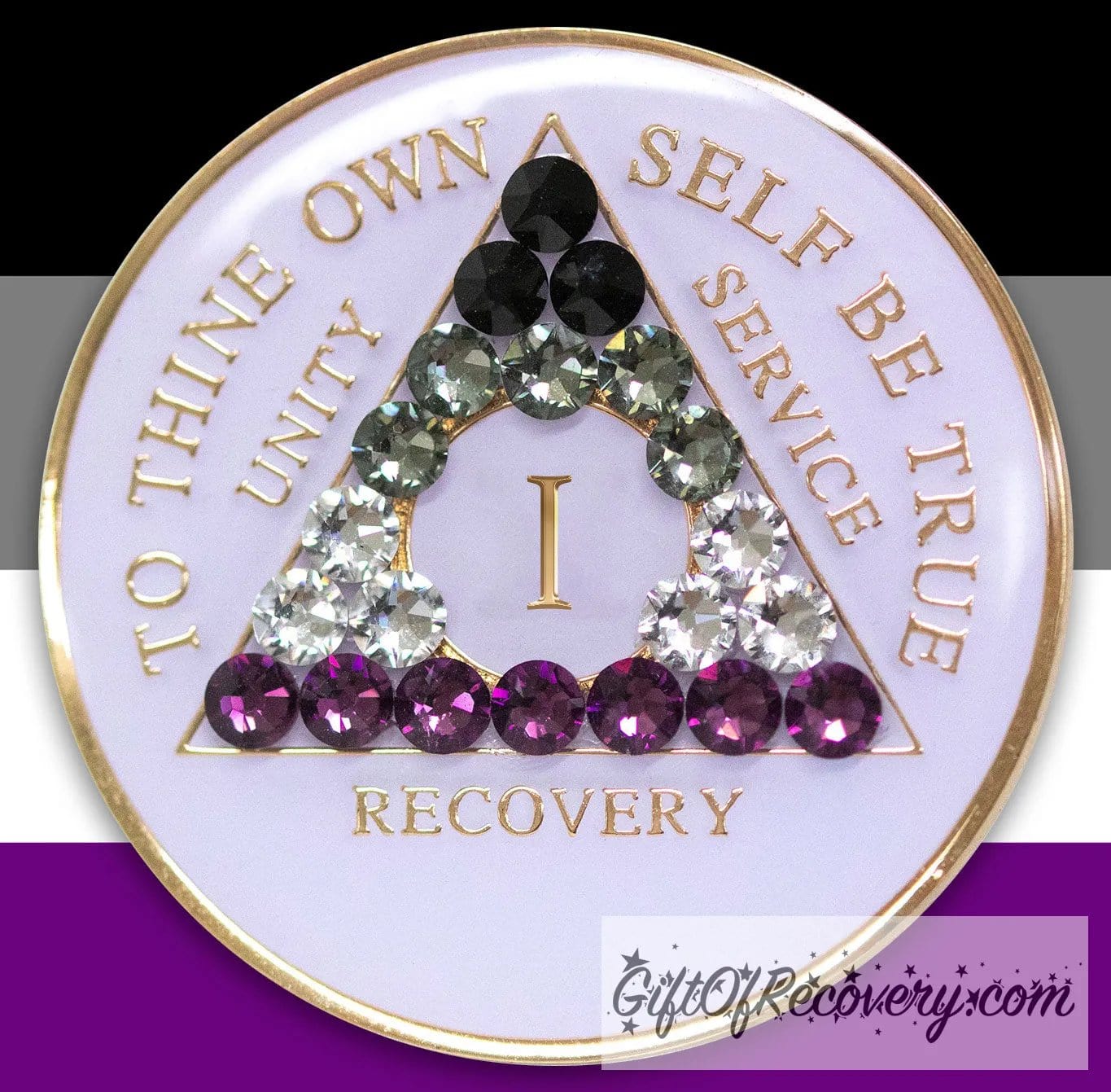 1 year AA medallion pearl white with 21 genuine crystals that make up the Asexual flag to represent recovery and pride, sobriety is a safe space, the AA slogan and three legacies are embossed with 14k gold-plated brass, sealed with resin for a glossy finish, pictured on a 3x3 card with the colors of the Asexual flag.