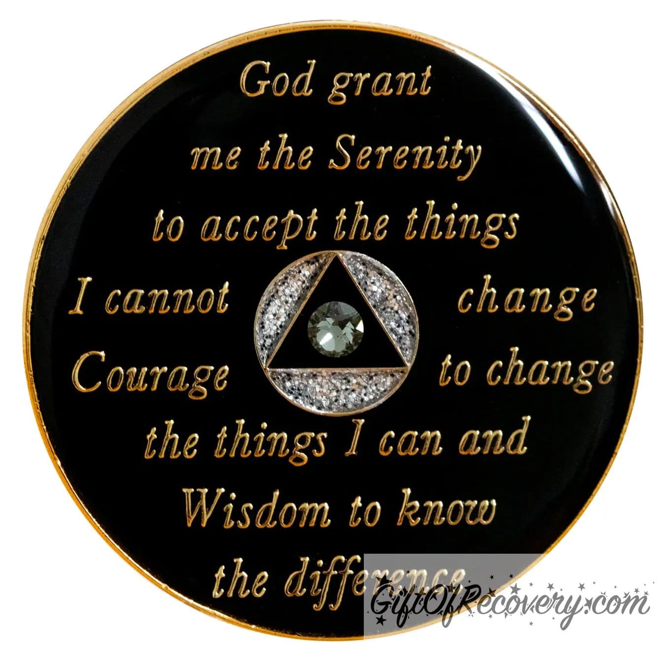 Back of silver glitter transition AA recovery medallion is black and has the serenity prayer, outer rim, and the circle triangle in the center embossed with 14k gold-plated brass, the circle is silver glitter and triangle is black with one single grey genuine crystal in the center of the triangle, the recovery medallion is sealed with resin for a shiny finish. 