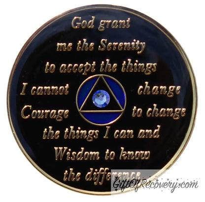 Back of Big Book blue bloom CZ crystalized AA recovery medallion is black onyx and has the serenity prayer, outer rim, and the circle triangle in the center 14k gold-plated brass, the circle is blue and triangle is black with one single blue CZ genuine crystal in the center of the triangle, the recovery medallion is sealed with resin for a shiny finish.