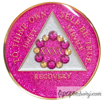 35 year AA medallion princess pink glitter with 6 gold CZ genuine crystals and 6 pink zircon forming a circle around the roman numeral to represent blooming in the program and growing where you are planted, the triangle is pearl white and AA moto is embossed with 14k gold-plated brass, sealed with resin for a glossy finish that will last and is scratch proof.