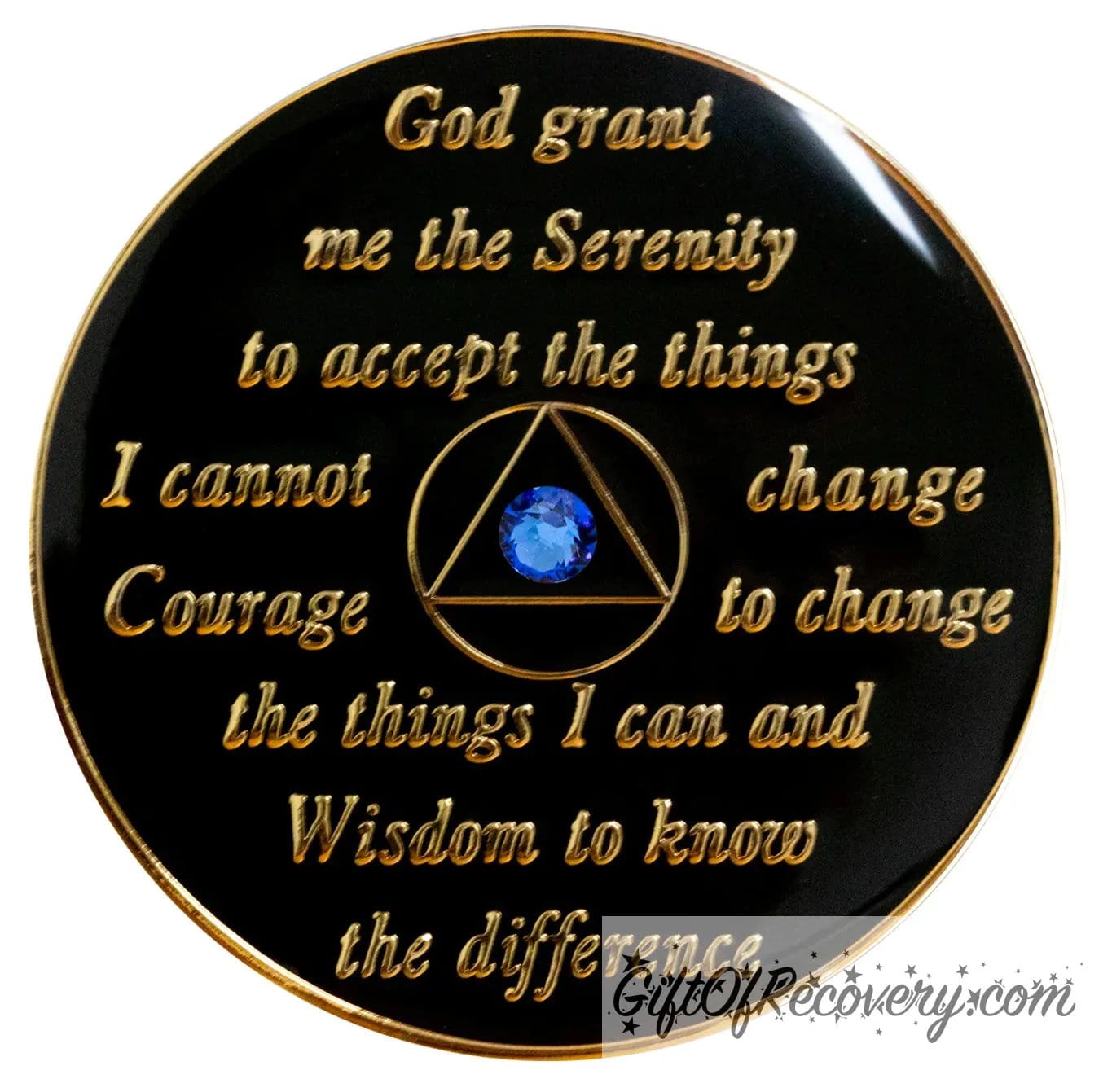 Back of transition AA recovery medallion is black onyx and has the serenity prayer, outer rim, and the circle triangle in the center 14k gold-plated brass, the circle and triangle are black with one single blue genuine crystal in the center of the triangle, the recovery medallion is sealed with resin for a shiny finish. 