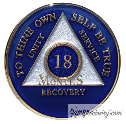 18 months AA medallion Big Book blue, to symbolize the Alcoholics Anonymous Big Book and program triangle is pearl white, to thine own self be true, unity, service, recovery, and roman numeral are embossed with 14k gold-plated brass, the recovery medallion is sealed with resin for a glossy finish that will last and is scratch free.