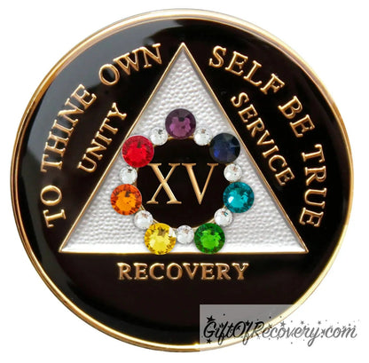 15 year black onyx AA medallion with 14 genuine crystals that form a circle around the roman numeral, seven of the crystals are different colors, each color representing a chakra the other 7 are smaller clear crystals, triangle is silver, and to thine own self be true, unity, service, recovery are embossed with 14k gold plated brass as well as the triangle, rim, and roman numeral, the medallion is sealed with resin for a glossy finish.