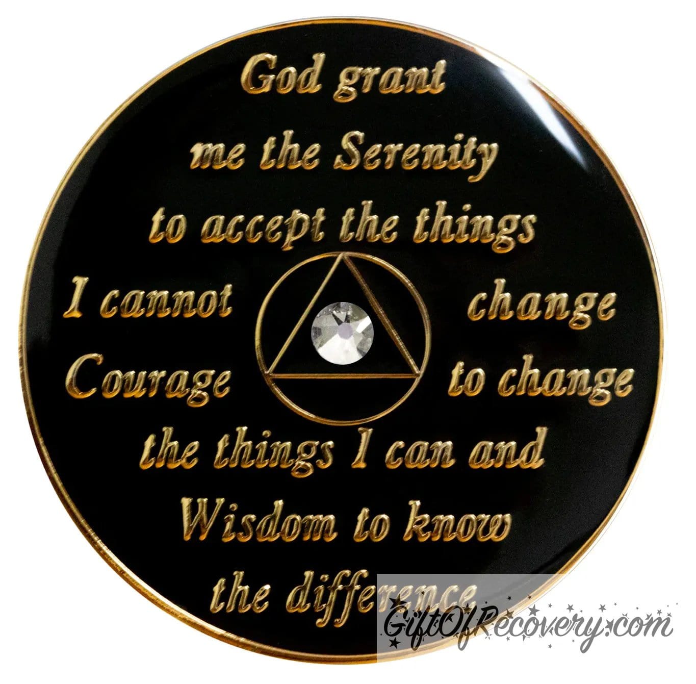 Back of AA Chakra triangle recovery medallion is black and has the serenity prayer, outer rim, and the circle triangle in the center embossed with 14k gold-plated brass, the circle and triangle are black with one single clear genuine crystal in the center of the triangle, the recovery medallion is sealed with resin for a shiny finish. 