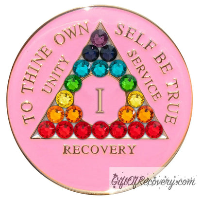 1 Year AA medallion princess pink with 21 CZ genuine crystals to represent the chakra elements by color in the triangle, AA slogan and 3 legacies are embossed with 14k gold-plated brass, sealed with resin for a lasting finish.