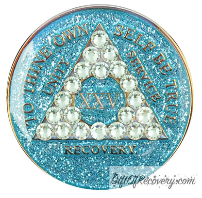 25 year deep sea Aqua glitter AA medallion adorned with 21 diamond CZ genuine crystals in the shape of the triangle that represent growth under pressure, to thine own self be true, unity, service, recovery are embossed with 14k gold-plated brass and sealed with resin for a lasting finish.