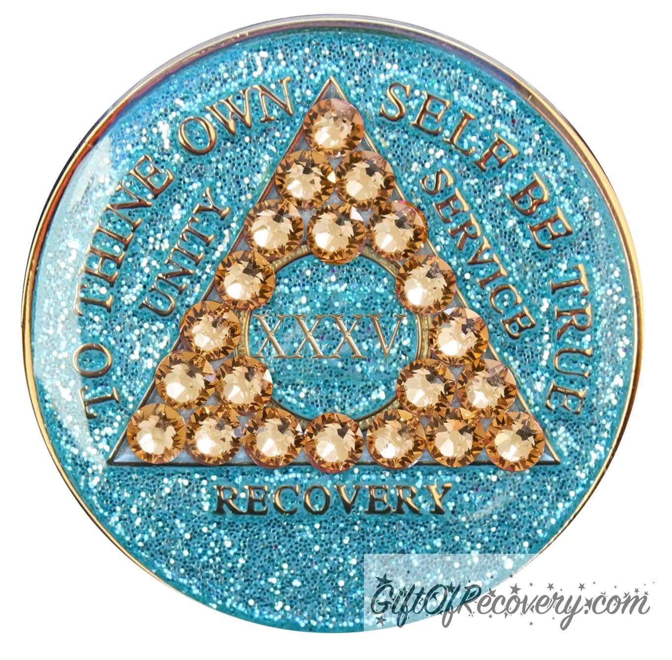 35 year Aqua glitter AA medallion with 21 gold genuine crystal making a triangle in the center, and to thine own self be true, unity, service, recovery, the roman numeral in the center and the rim of the recovery medallion embossed in 14k gold plated brass and sealed with resin for a glossy shine.