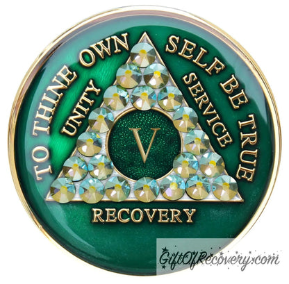 5 year AA medallion Emerald green with 21 genuine Peridot crystals that make the triangle, to represent beauty and peace in the program, AA slogan and three legacies are embossed with 14k gold-plated brass and sealed for a glossy finish that will last.