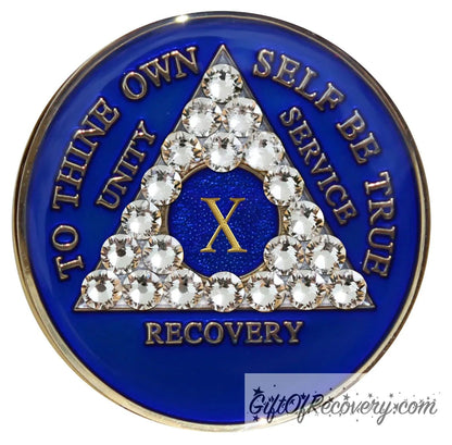 10 year AA medallion Big Book Blue with 21 genuine diamond CZ crystals to form the triangle and emphasize strength under pressure that is built in the program, AA slogan and three legacies are embossed 14k gold-plated brass, recovery medallion is sealed with resin for a shiny finish.