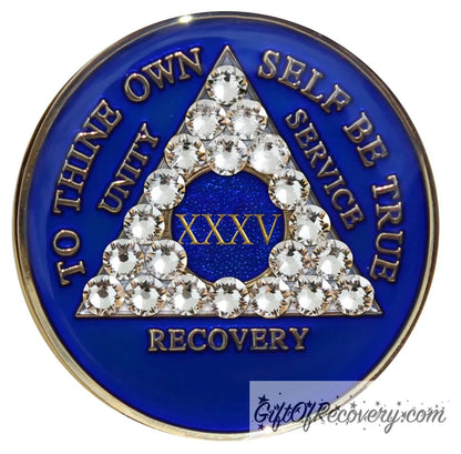 35 year AA medallion Big Book Blue with 21 genuine diamond CZ crystals to form the triangle and emphasize strength under pressure that is built in the program, AA slogan and three legacies are embossed 14k gold-plated brass, recovery medallion is sealed with resin for a shiny finish.