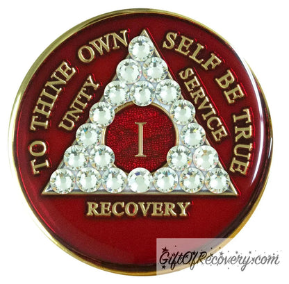 1 year ruby red AA medallion adorned with 21 genuine diamond CZ crystals emphasizing the growth under pressure like true diamonds are formed, to thine own self be true, unity, service, recovery are embossed with 14k gold-plated brass and sealed with resin for a glossy finish that is scratch proof and will last.