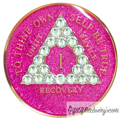 1 year AA recovery medallion in glitter princess pink and adorned with 21 diamond CZ genuine crystals shaped in the triangle to add sparkle to your sober princess journey in recovery, to thine own self be true, unity, service, recovery are embossed with 14k gold-plated brass and sealed with resin for a glossy finish that will last and is scratch proof.