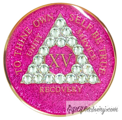 15 year AA recovery medallion in glitter princess pink and adorned with 21 diamond CZ genuine crystals shaped in the triangle to add sparkle to your sober princess journey in recovery, to thine own self be true, unity, service, recovery are embossed with 14k gold-plated brass and sealed with resin for a glossy finish that will last and is scratch proof.