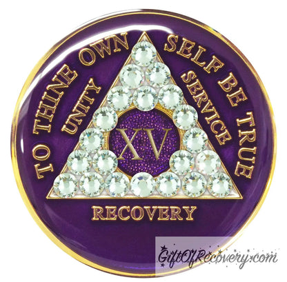 15 year AA medallion purple amethyst, adorned with 21 genuine diamond CZ crystals to represent transformation under pressure in the recovery journey, to thine own self be true, unity, service, recovery embossed with 14k gold-plated brass and sealed with resin for a glossy finish that is scratch proof and will last.