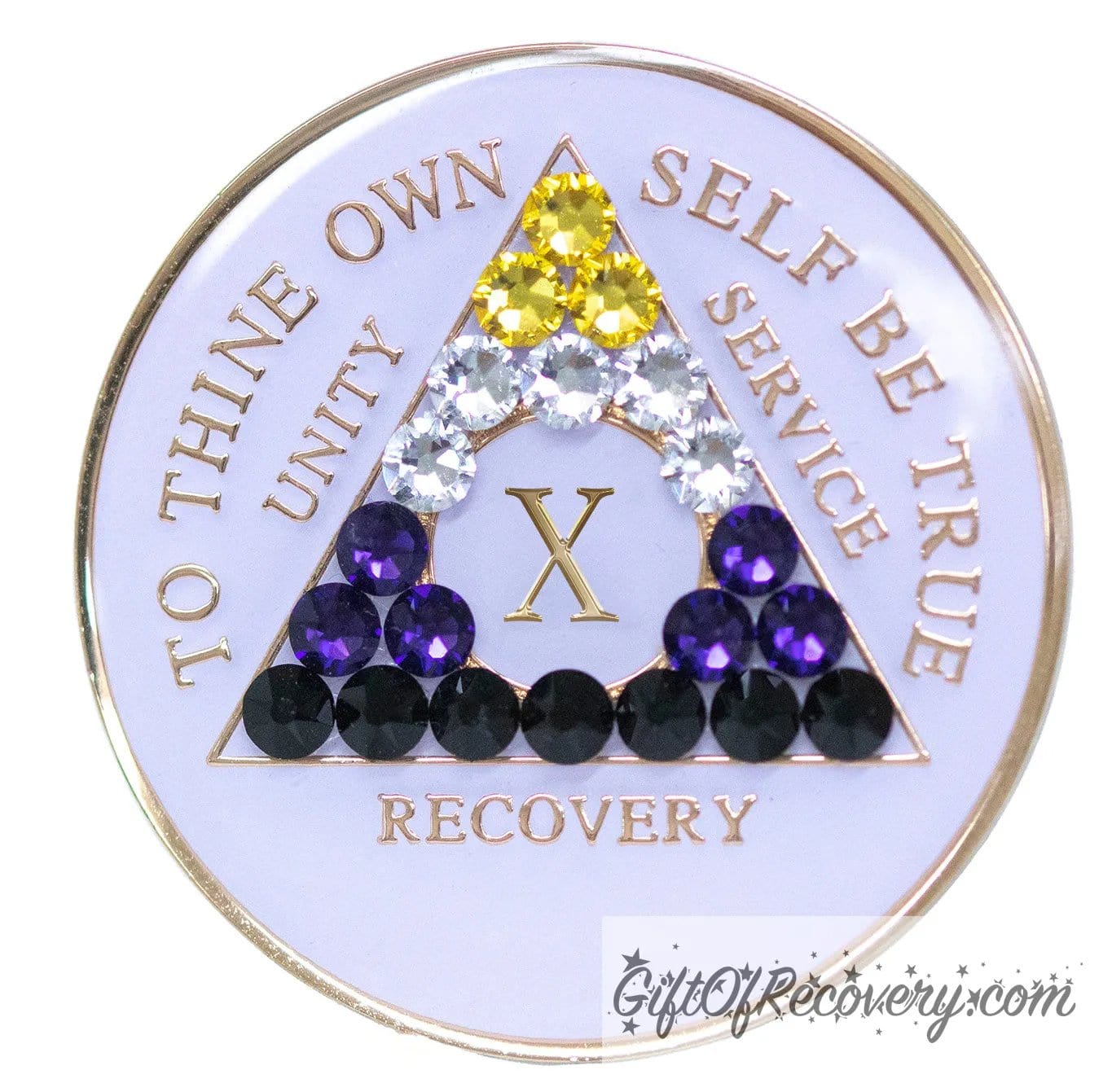 10 year AA medallion pearl white with 21 genuine crystals that form the triangle and are in the color of the nonbinary flag, to represent pride and sobriety, the AA slogan and three legacies are embossed with 14k gold-plated brass and sealed with resin for a glossy finish that will last and is scratch proof.