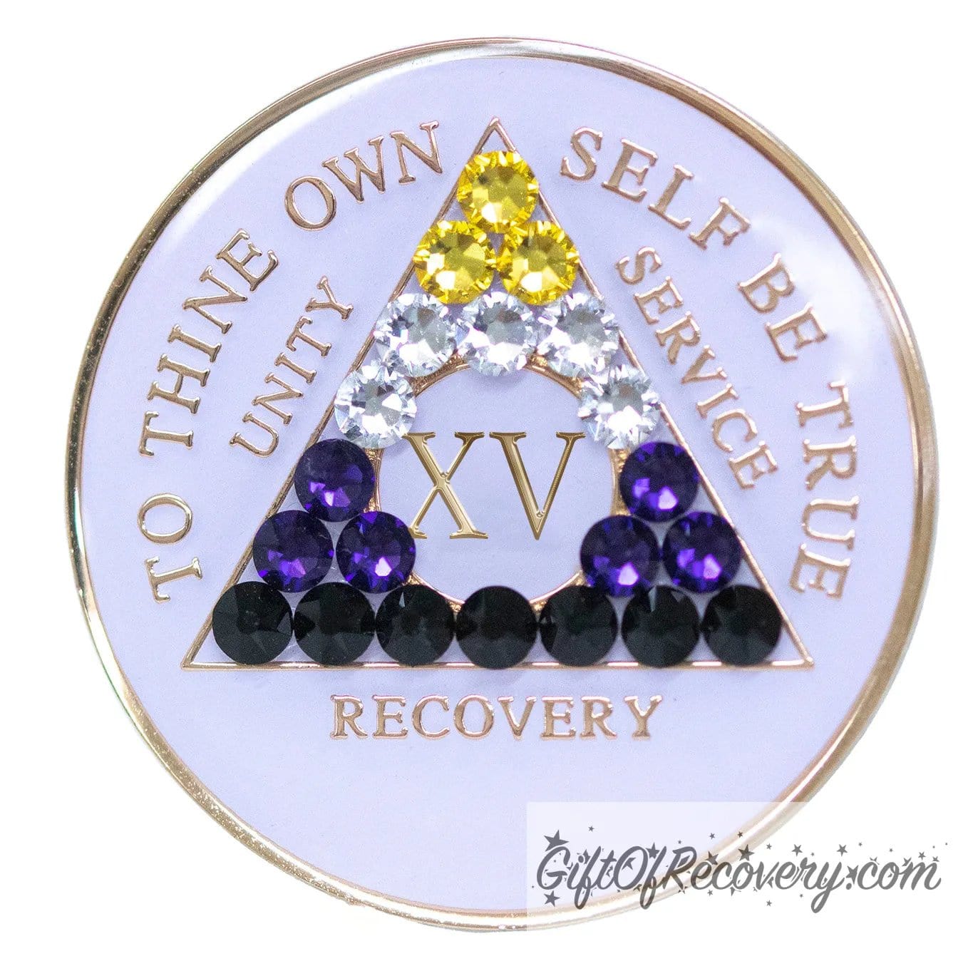 15 year AA medallion pearl white with 21 genuine crystals that form the triangle and are in the color of the nonbinary flag, to represent pride and sobriety, the AA slogan and three legacies are embossed with 14k gold-plated brass and sealed with resin for a glossy finish that will last and is scratch proof.