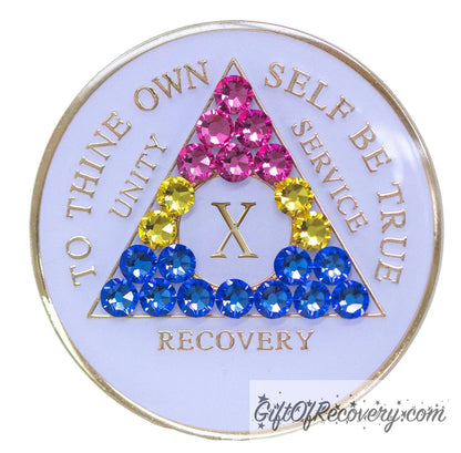 10 year AA medallion pearl white with 21 genuine crystals that form the triangle and are in the color of the Pansexual flag, to represent pride and sobriety, the AA slogan and three legacies are embossed with 14k gold-plated brass and sealed with resin for a glossy finish that will last and is scratch proof.