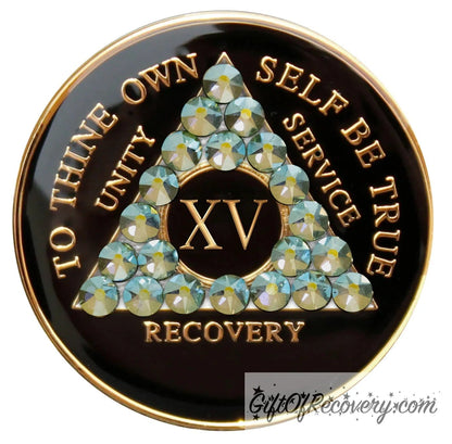 15 year AA medallion Black onyx, with 21 genuine Peridot AB crystals in the shape of the triangle, to thine own self be true, unity, service, recovery, and the roman numeral, are embossed with 14k gold-plated brass, the recovery medallion is sealed with resin for a glossy finish that lasts and is scratch proof.