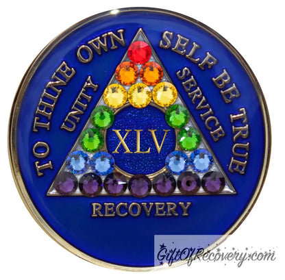 45 year AA medallion Big Book blue with 21 genuine crystals in rainbow form and the shape of the triangle, representing renewal and growth in the program, and also to represent the LBGTQIA+ community, AA slogan and three legacies embossed with 14k gold-plated brass, sealed with resin for a glossy finish that is scratch proof and will last.